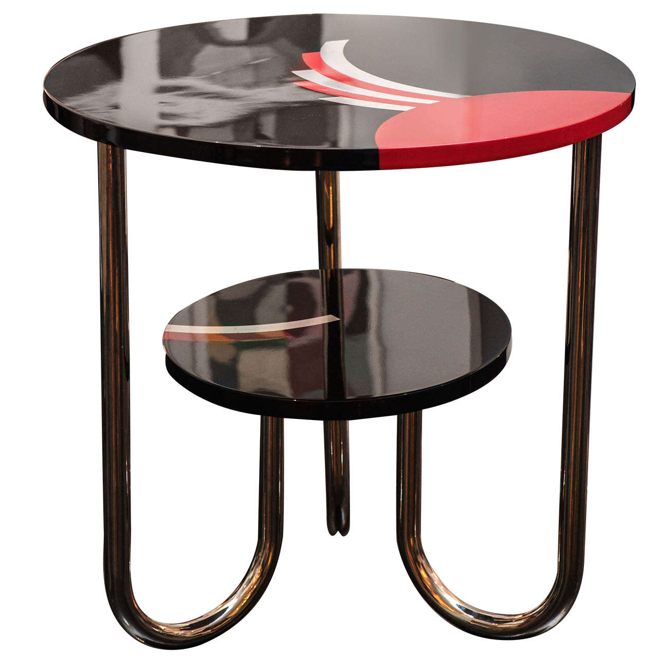 1940's Bauhaus-Deco side table in black lacquer. Red lacquer and silver leaf details on both tiers and three chrome legs.