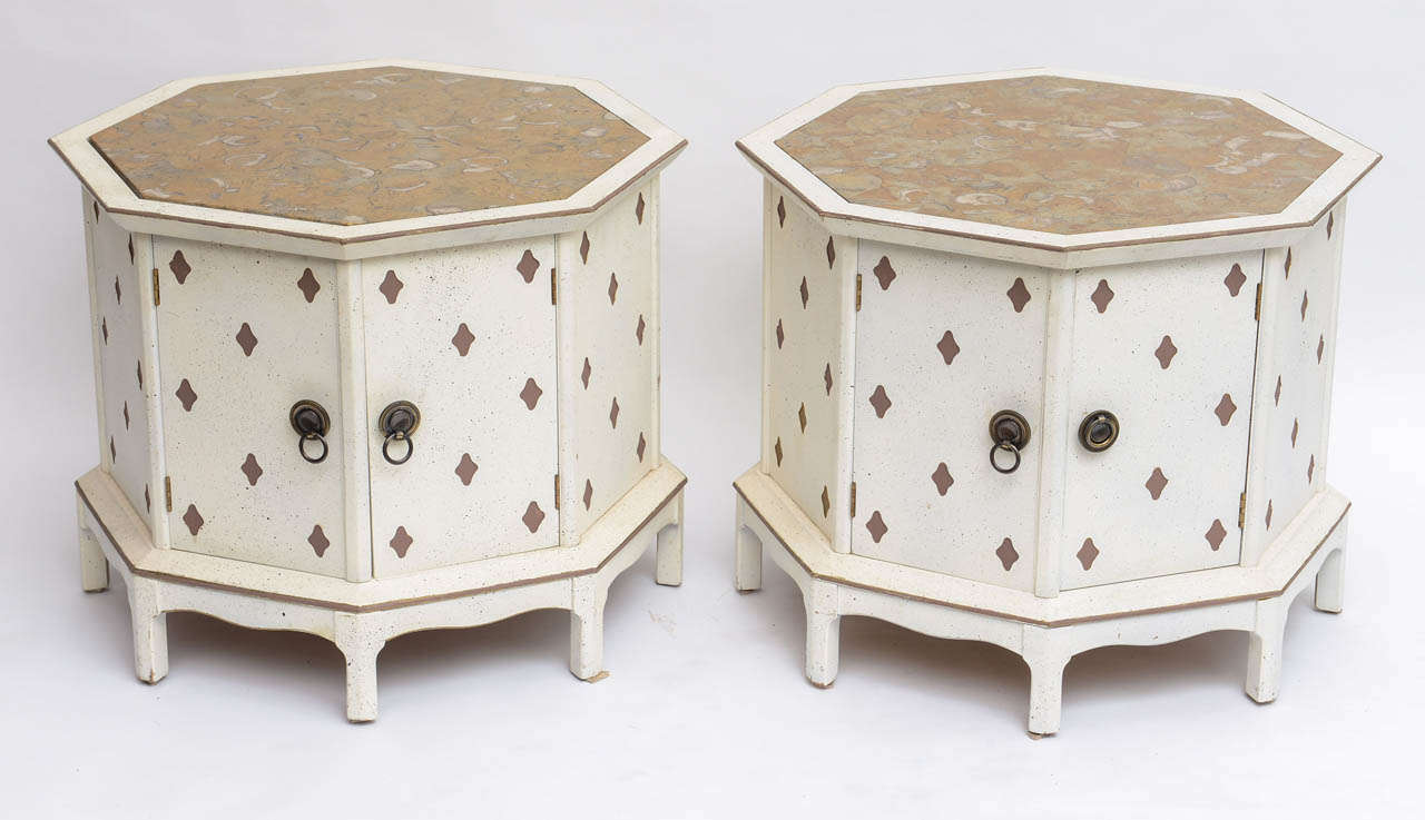 Chic pair of marble topped hexagonal painted end tables with brass hardware. Two doors open for spacious storage.
