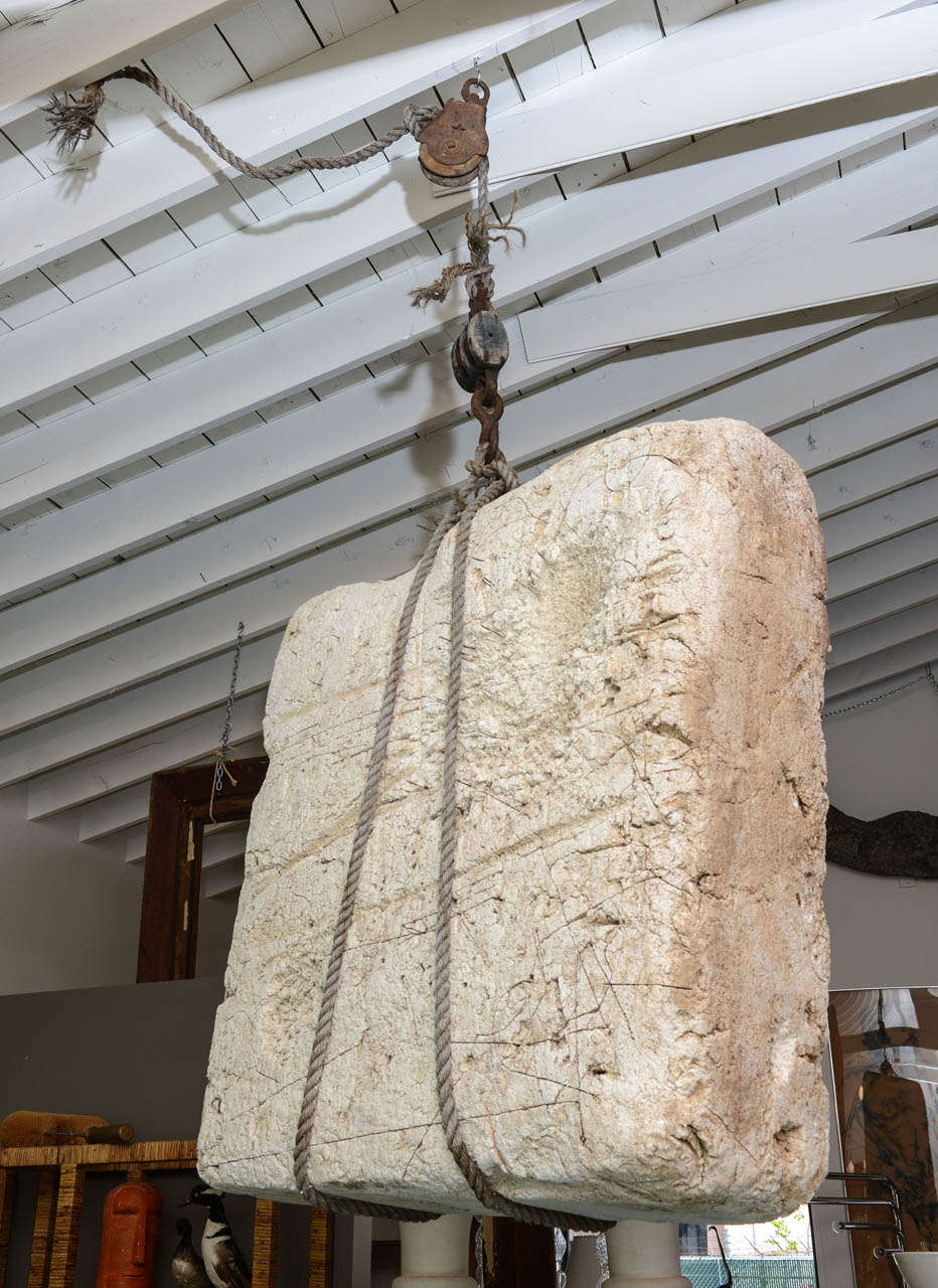 Fantastic large, hanging sculpture of a 'boulder' made of Styrofoam. With rope and iron hoist.