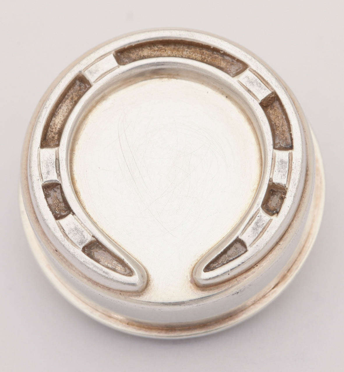 Hermes Sterling Silver Horseshoe Pill Box with vermeil interior. Marked Hermes Paris.