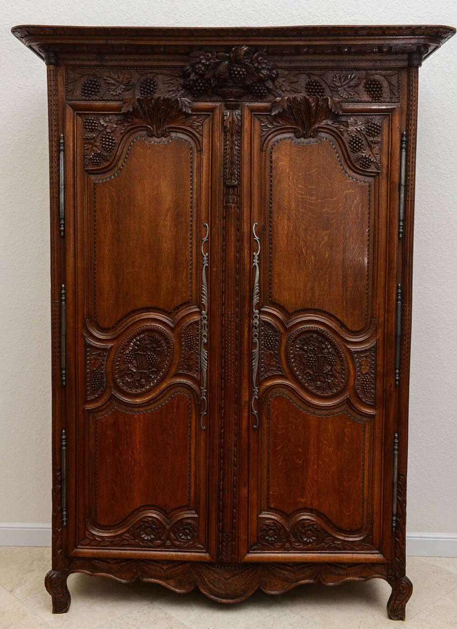 Armoire has the original restored finish, original hardware. Beautifully carvings everywhere.   Interior has three full & depth shelves. The crown & doors may be removed for delivery

Originally $ 14,000.00