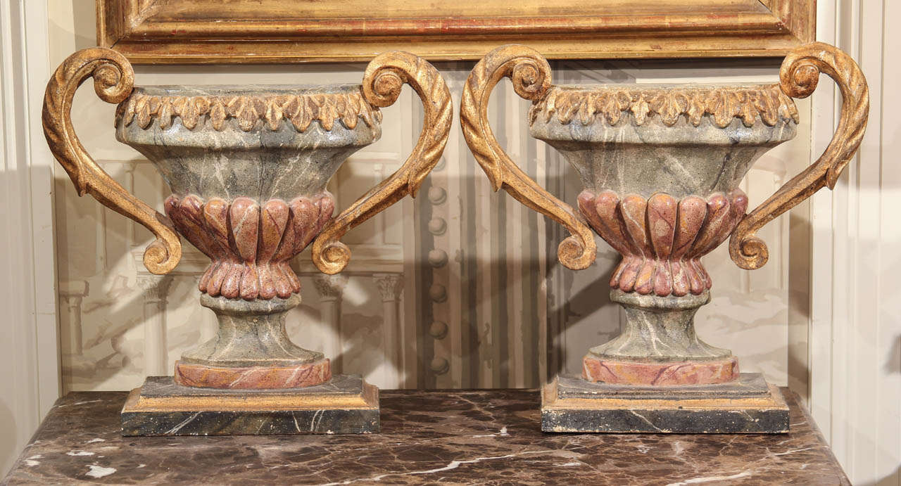 A pair of antique carved , marbleized and gilt wood ornamental flat vases wit the potential to be converted into lamp bases.