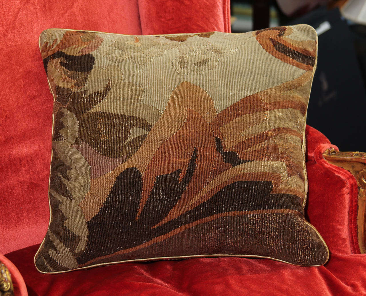 A pillow made from a 19th century Aubusson fragment. Feather down fill.