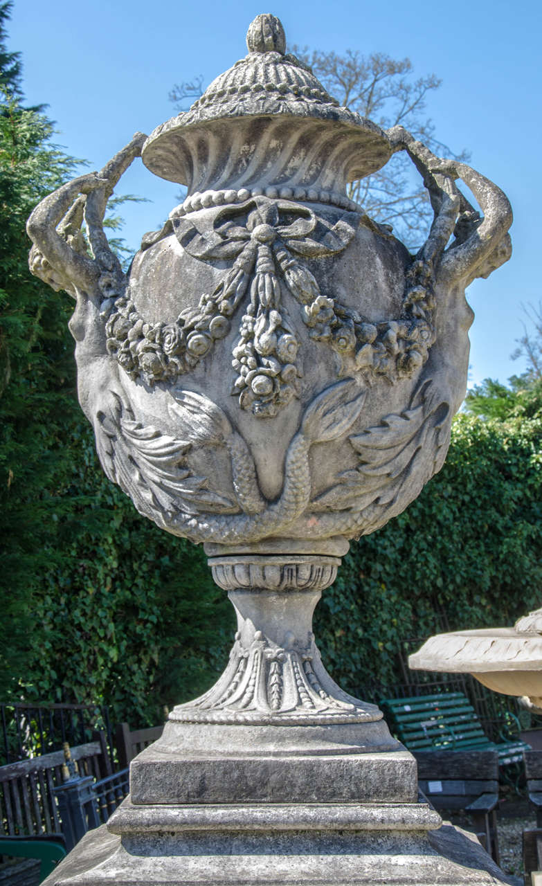 Neoclassical Pair of Large Ornate Stone Urns on Plinths For Sale