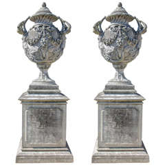 Pair of Large Ornate Stone Urns on Plinths