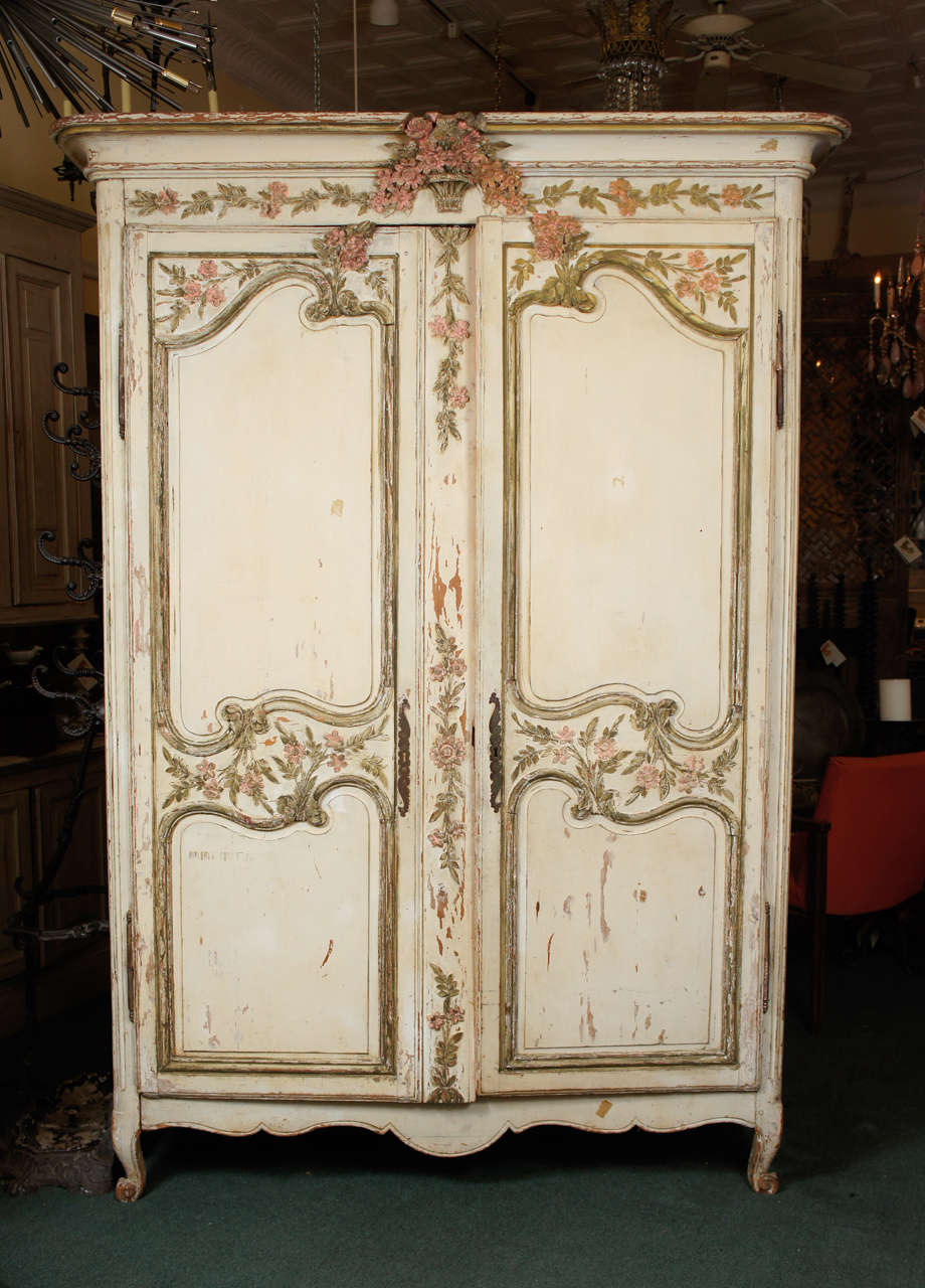 A beautifully painted and natural destressed painted French country Wedding Armoire, from Normandy. The interior was painted and sectioned off much later. 