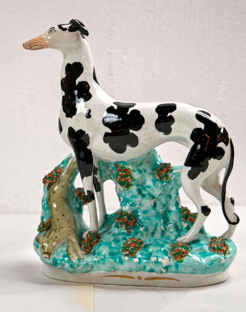 A beautiful Staffordshire, greyhounds with rabbits. A finely decorative hand- painted  sculpture.