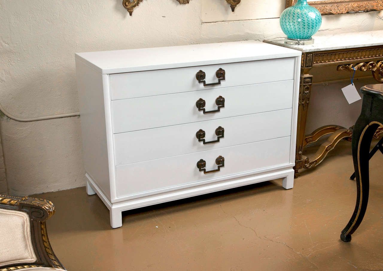 Landstrom custom quality bachelor chest. Bracket feet support this fine white paint decorated commode with graduating drawers. The interior made of oak. Wonderfully simply with brass hardware.
