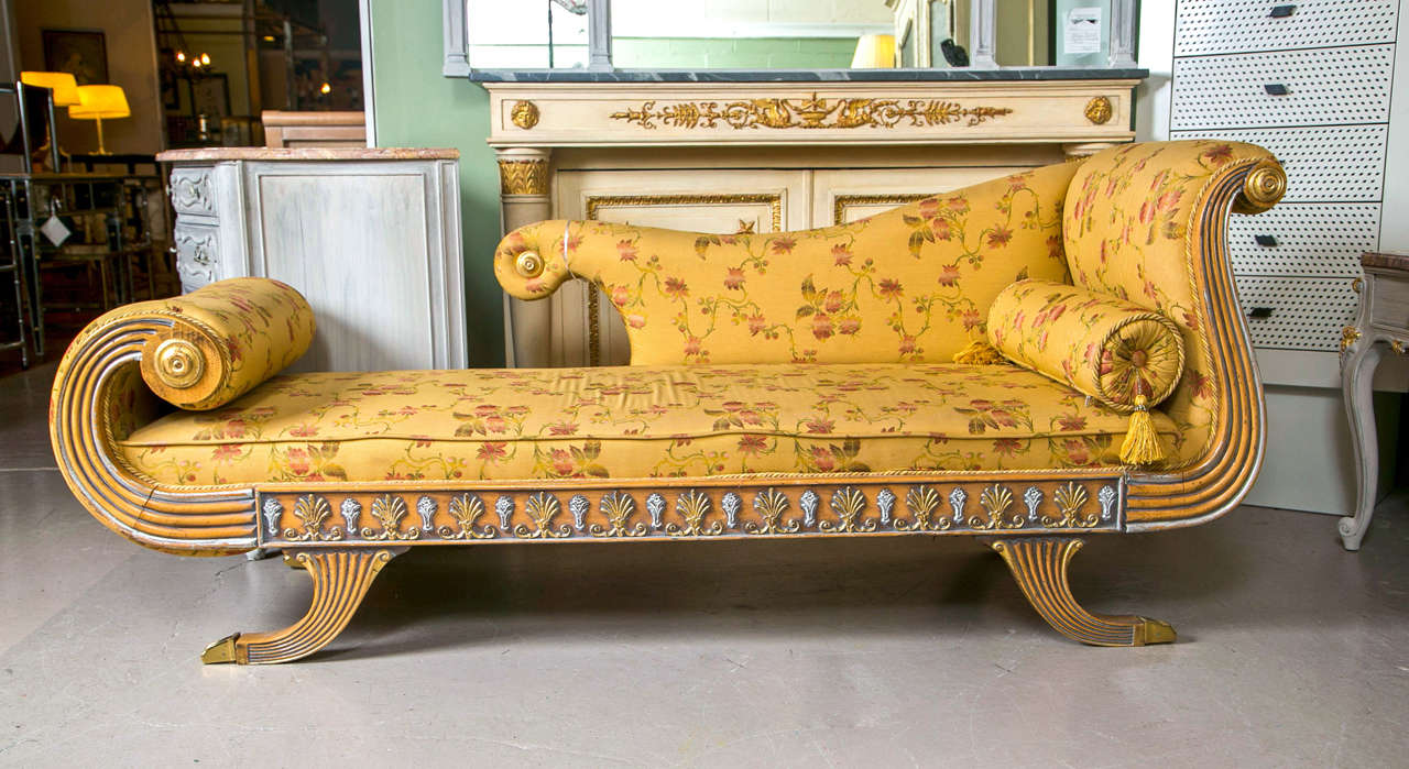 A fine silver gilt and wooden sprayed leg Chaise Lounge / Daybed. This nicely upholstered Chaise sits on four sprayed legs all with brass casters leading to a fine upholstered bed. 