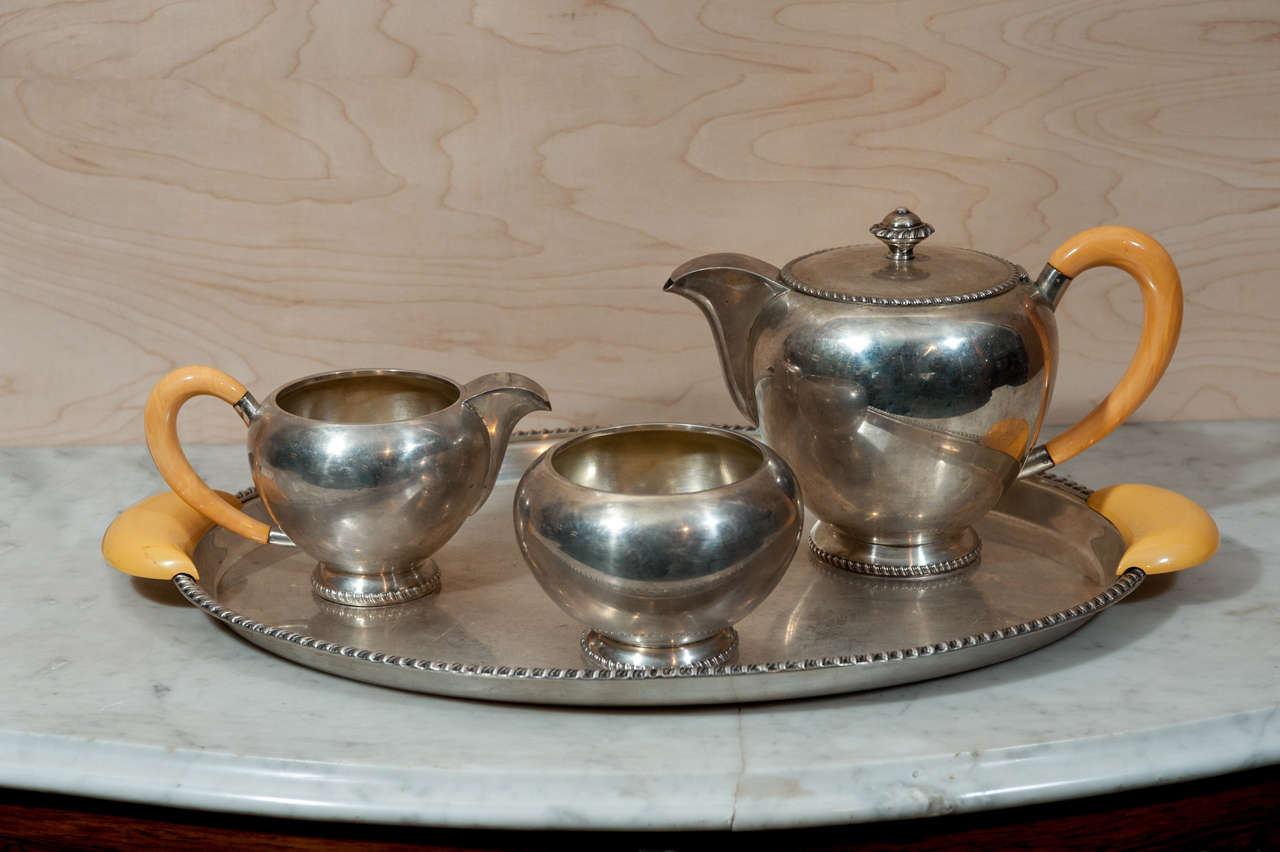 4 piece continental 800 silver teaset with tray, teapot and milk and sugar vessels. Marked 'G dell bono'. Measurements provided are for tray only. Teapot measures 10