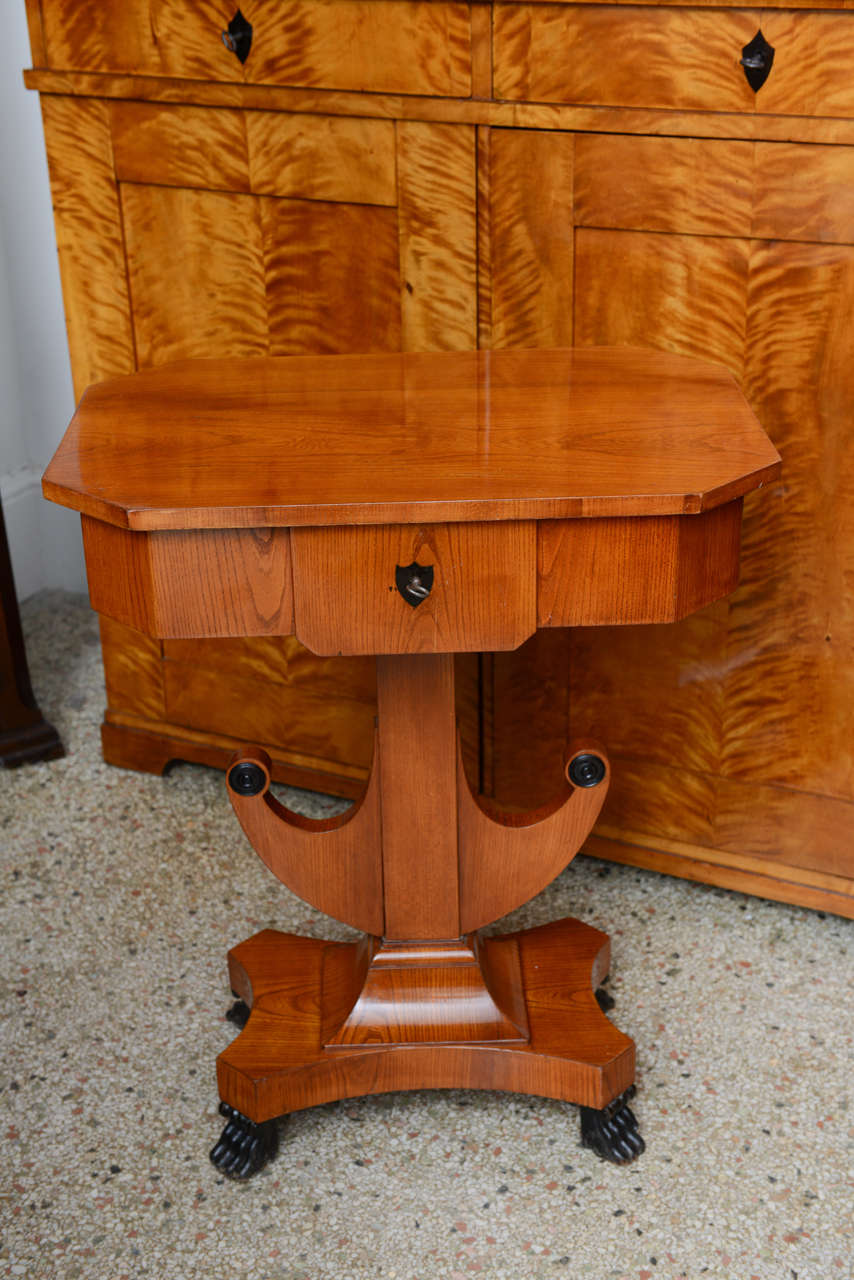 Biedermeier Sewing Work Table, Elmwood, Swedish, single hinged top with compartment interior; ebonized feet, key escutcheon & details, original restored finish

In Central Europe, the Biedermeier era refers to the middle-class sensibilities of the
