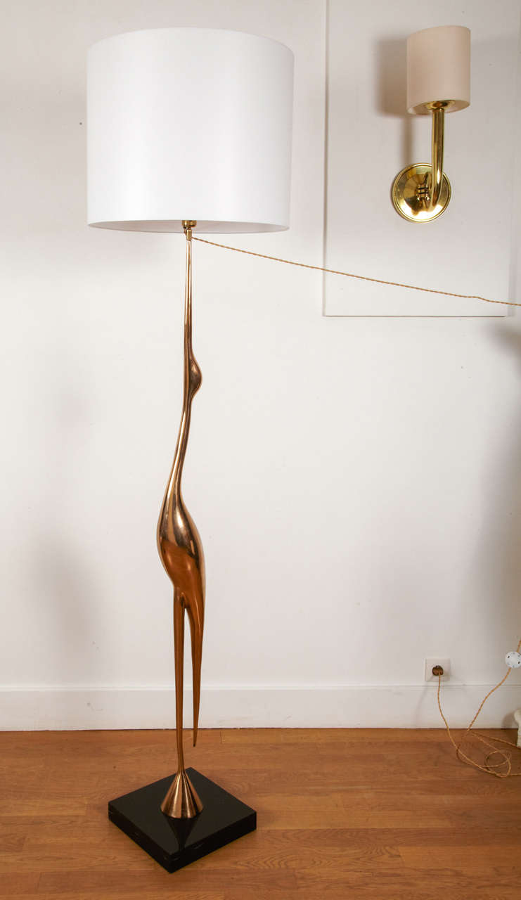 Polished bronze floor lamp as a wading bird, by René Broissand, circa 1970. Square brown plexiglas base.
Bird height 160 cm.  Signed R.Broissand, Santangelo.

One smaller model is also available, see picture.

