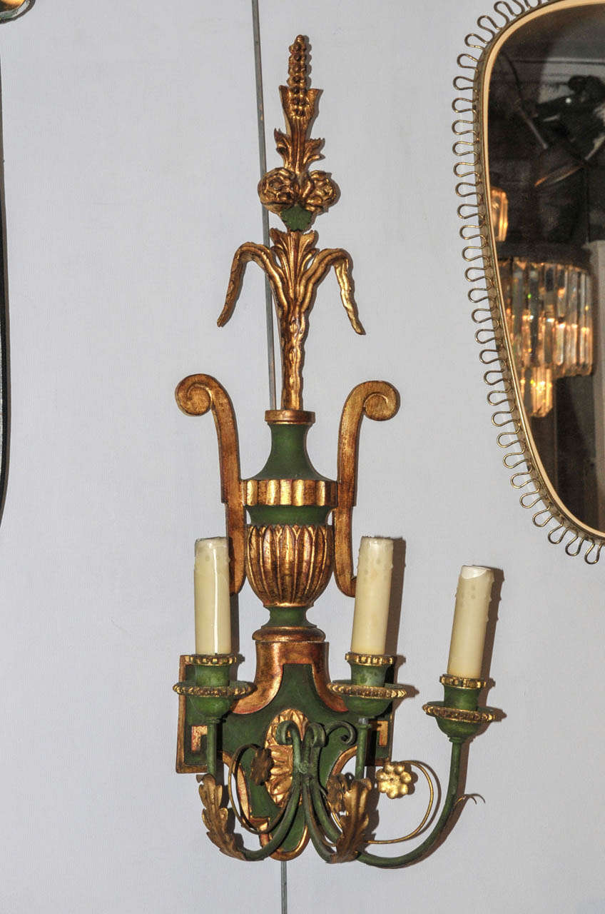 Pair of 19th Century sconces. Green patina and gilded wood and metal. Three lighted arms. Wired for European use. Good condition. Normal wear consistent with age and use.