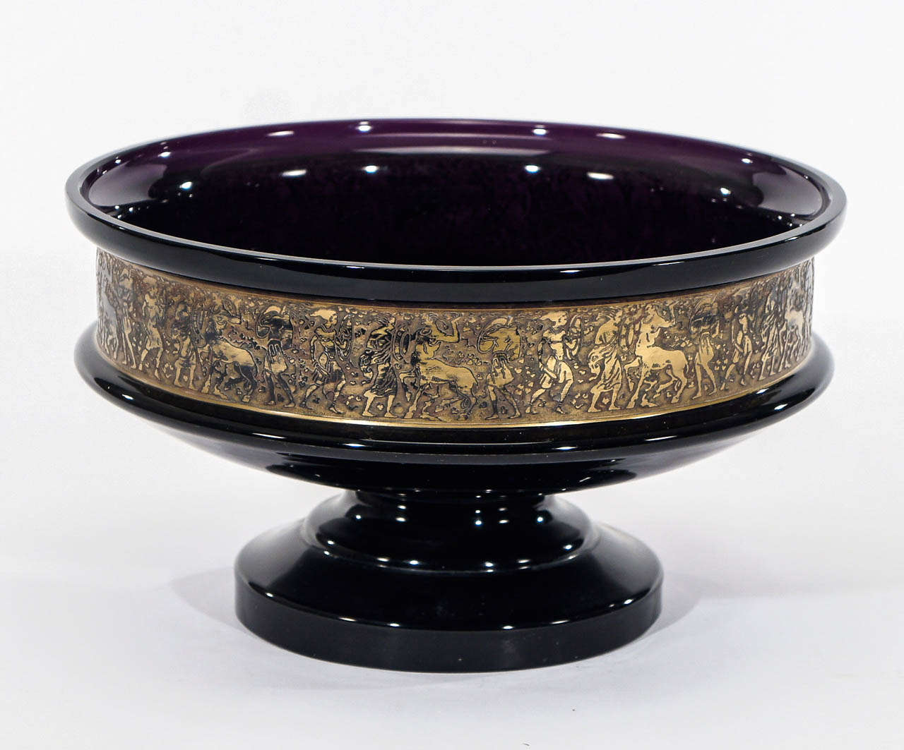 A beautiful example of Moser's Neoclassical designs as represented by this footed amethyst centerpiece. Hand blown deep purple crystal with a well- balanced supportive base, supports this decorative piece. The wide band around the body is decorated