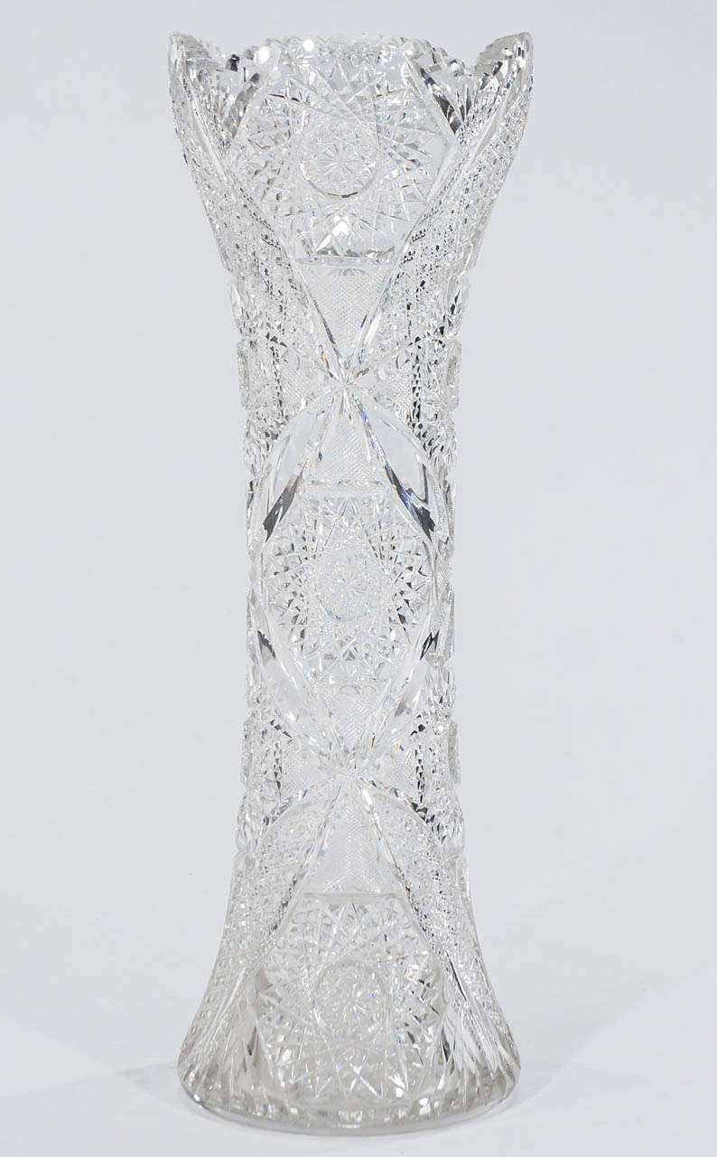 An incredibly detailed hand blown crystal vase with very refractive cuts polished to mirror reflection with beautiful cross-hatching Cane Pattern combined with Triple Hob star pattern. This vase is a show stopping piece standing at 20