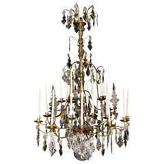 A Louis XV Period Gilded Bronze and Glass 27 Light Chandelier