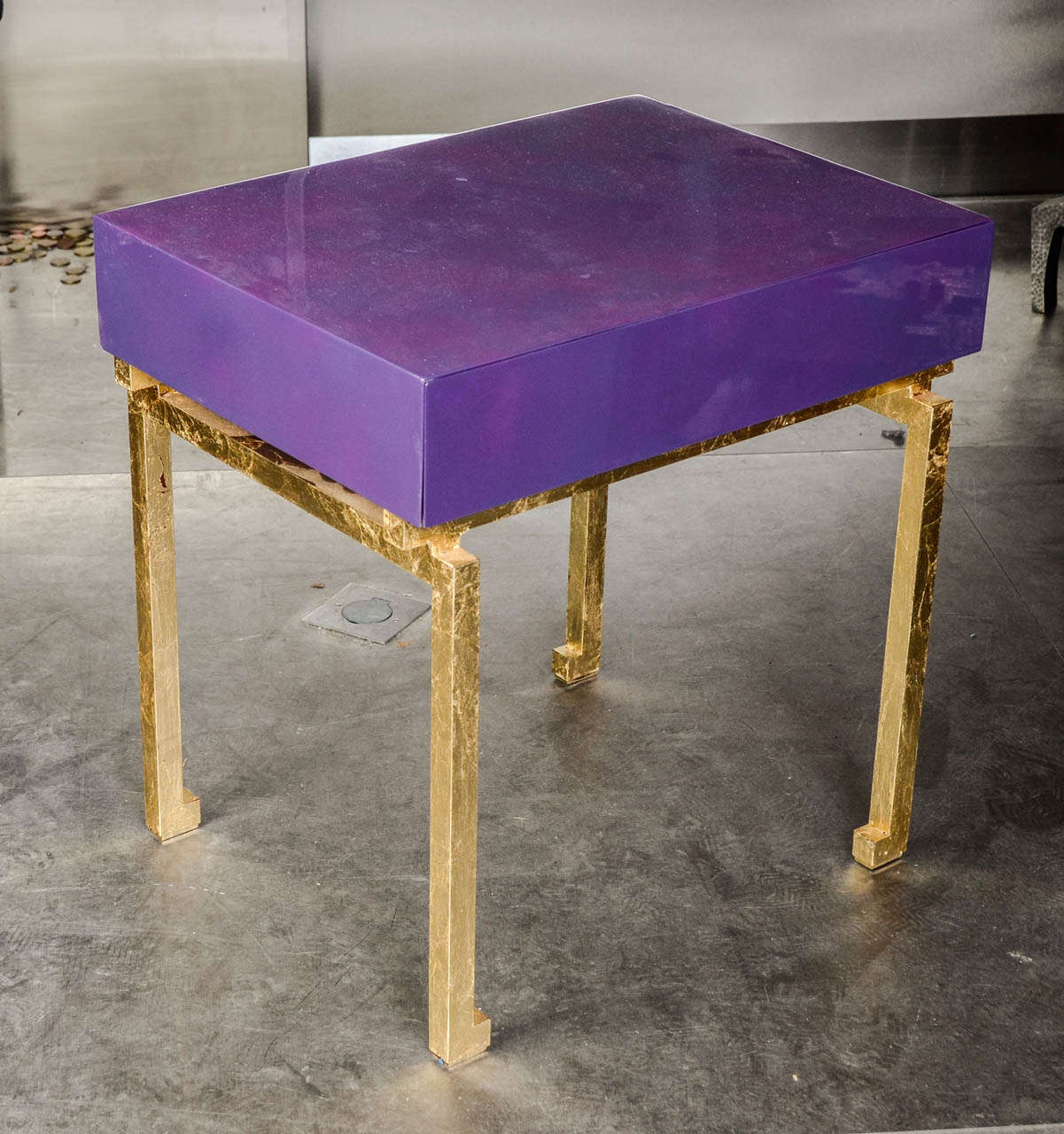 Lacquered wood top and gilt iron feet