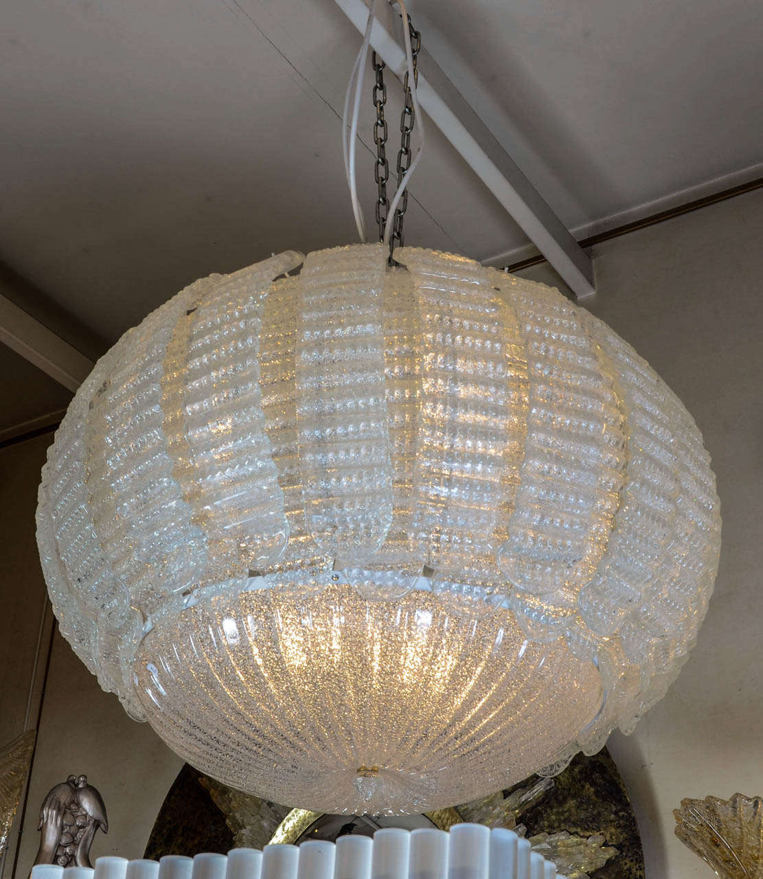 interesting chandelier in Murano glass. translucent glass with white particles.
Done in Murano by Angelo Barovier