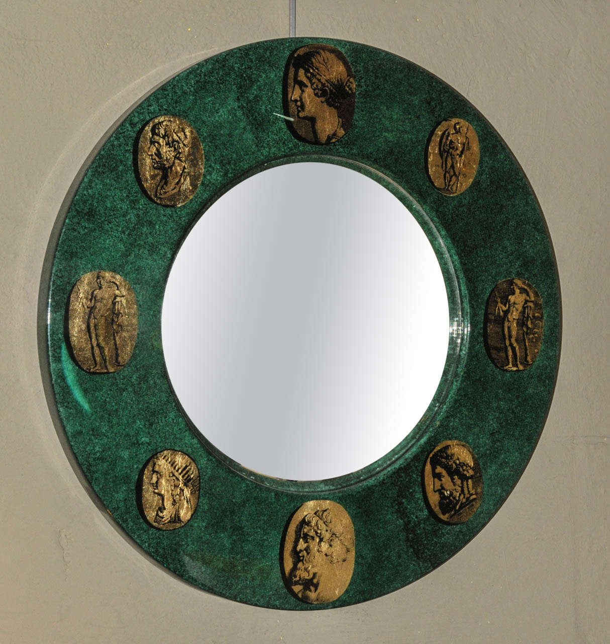 1970's mirror in lacquered and gilded wood by Fornasetti. Scratch on the mirror. Good condition. Normal wear consistent with age and use.