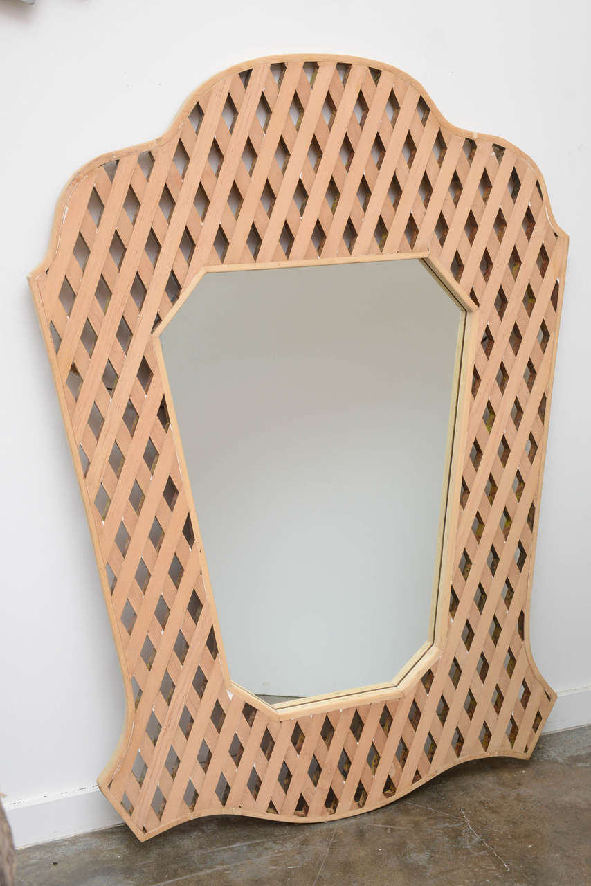 Outstanding wooden lattice mirror by Phyllis Morris.