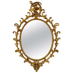 Georgian Style Gilt Exquisitely Carved Oval Mirror Adorning a Winged Eagle