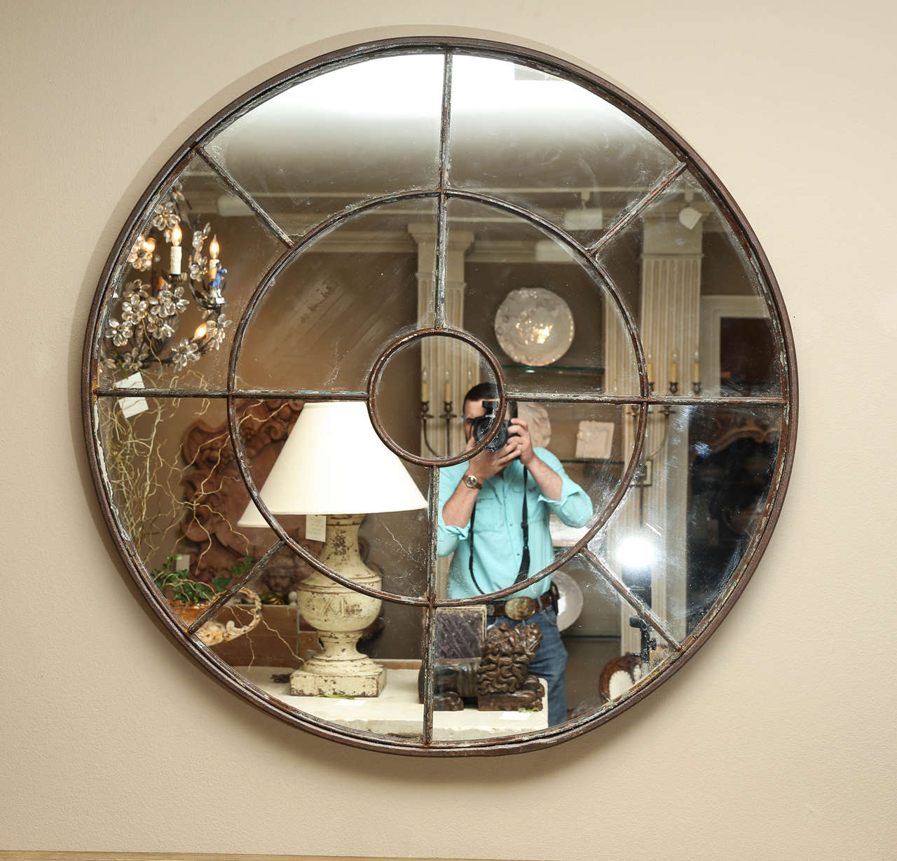 Large salvaged round iron window re purposed with new mirror. Email or call for details if needed. Has areas on back for hanging.