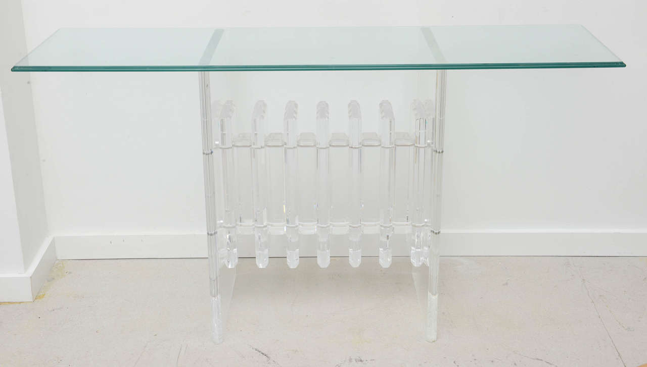 Vintage console table with a stacked Lucite base and glass top dated 1977.