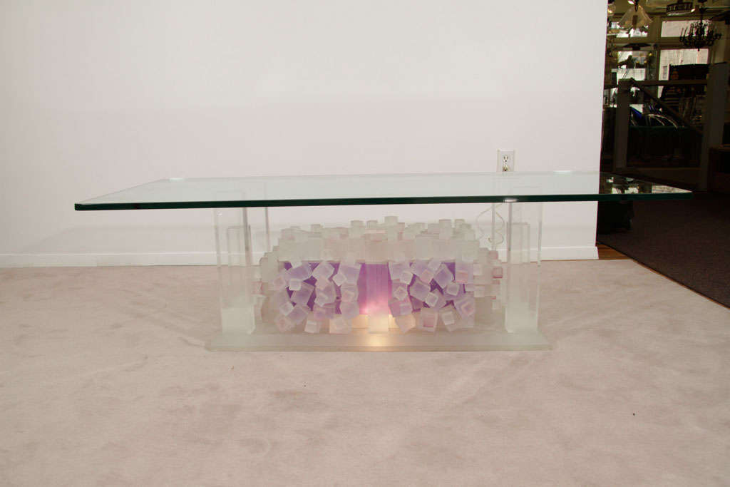 Purple and pink tinted stacked lucite cube table base with thick glass top. The Base illuminates to give a soft glow.<br />
<br />
Reduced From: $4200