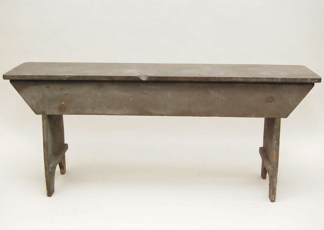 well developed country bucket bench<br />
square nail construction<br />
in original first paint<br />
untouched patina<br />
apron, half moon cut out feet, champhored cleats