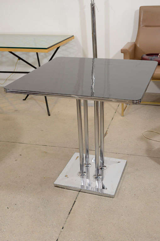 Rectangular table with Chrome base with black lacquered top
