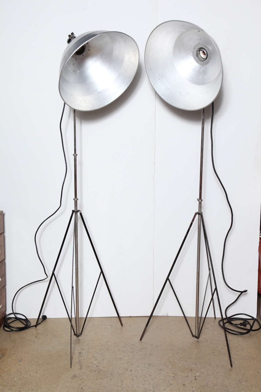 Tall set of 4 Johnson Ventlite Co. adjustable Photography Reflector Flood Lights, 1940's. Featuring Art Deco Nickel-plated Brass fixtures, attachable 19D Aluminium shades, that attach and detach with ease, adjustable (to 50H) stems and folding