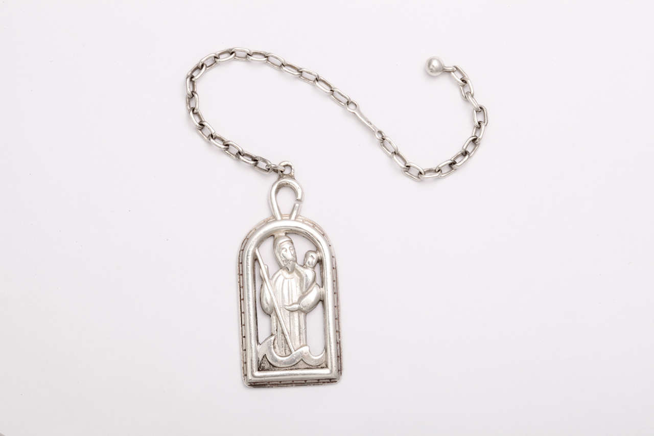 A sterling silver key chain depicting Saint Christopher. Signed 