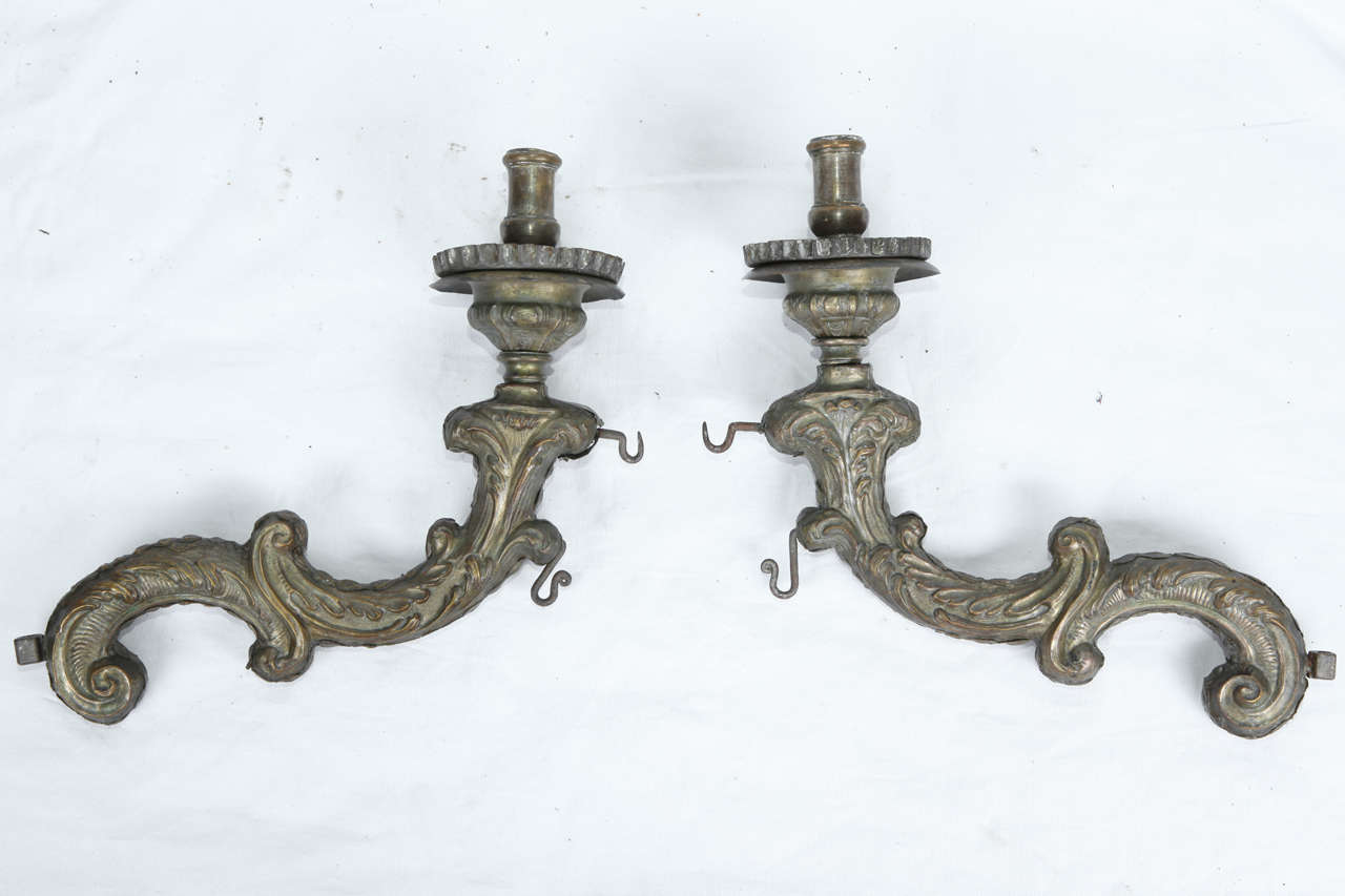 
Pair of wood torch holders covered by silver coated hand embossed sheet scrap. 18th century

