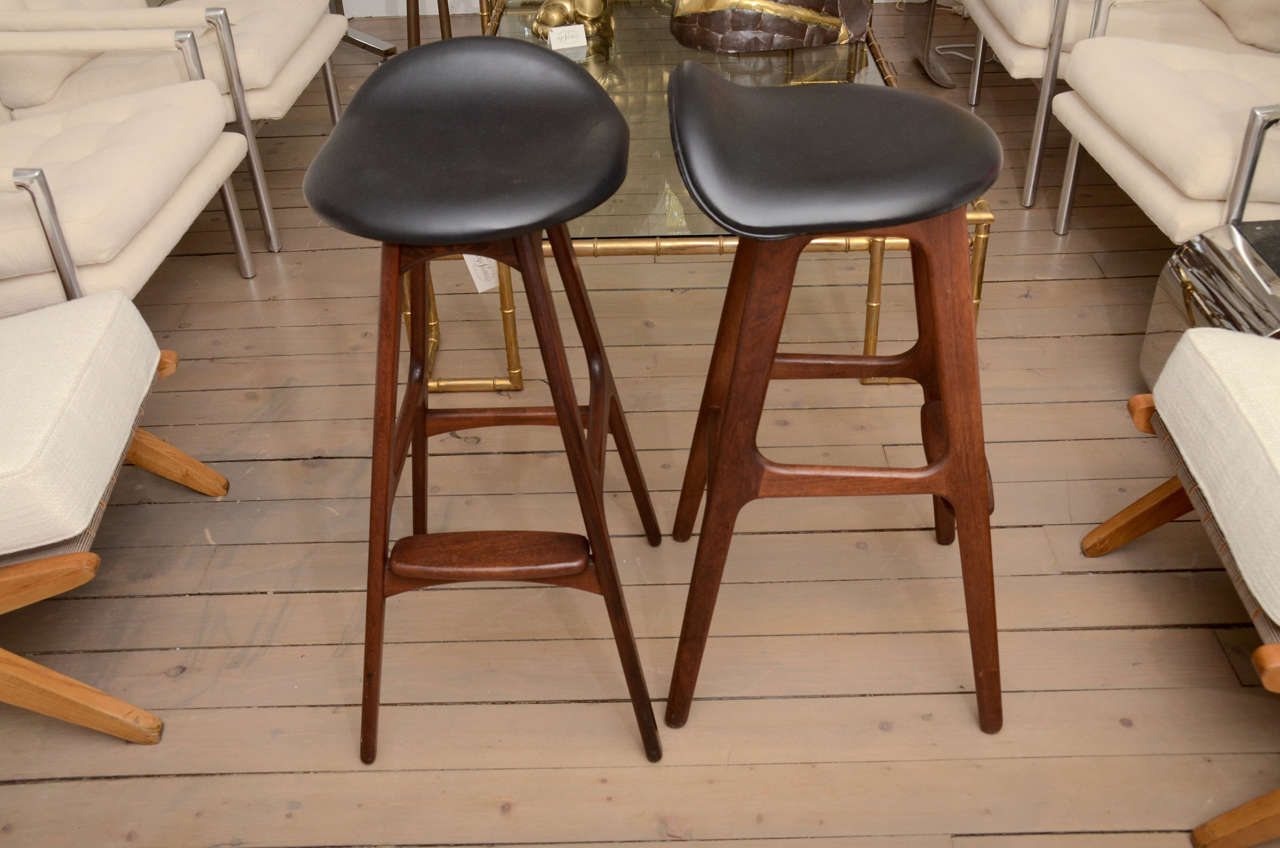 Pair of Eric Buck Bar Stools which are the same as on the AMC Television series Mad Men in Don Drapper's apartment! Live the cool Mid Century Modern with this pair of uber cool stools!