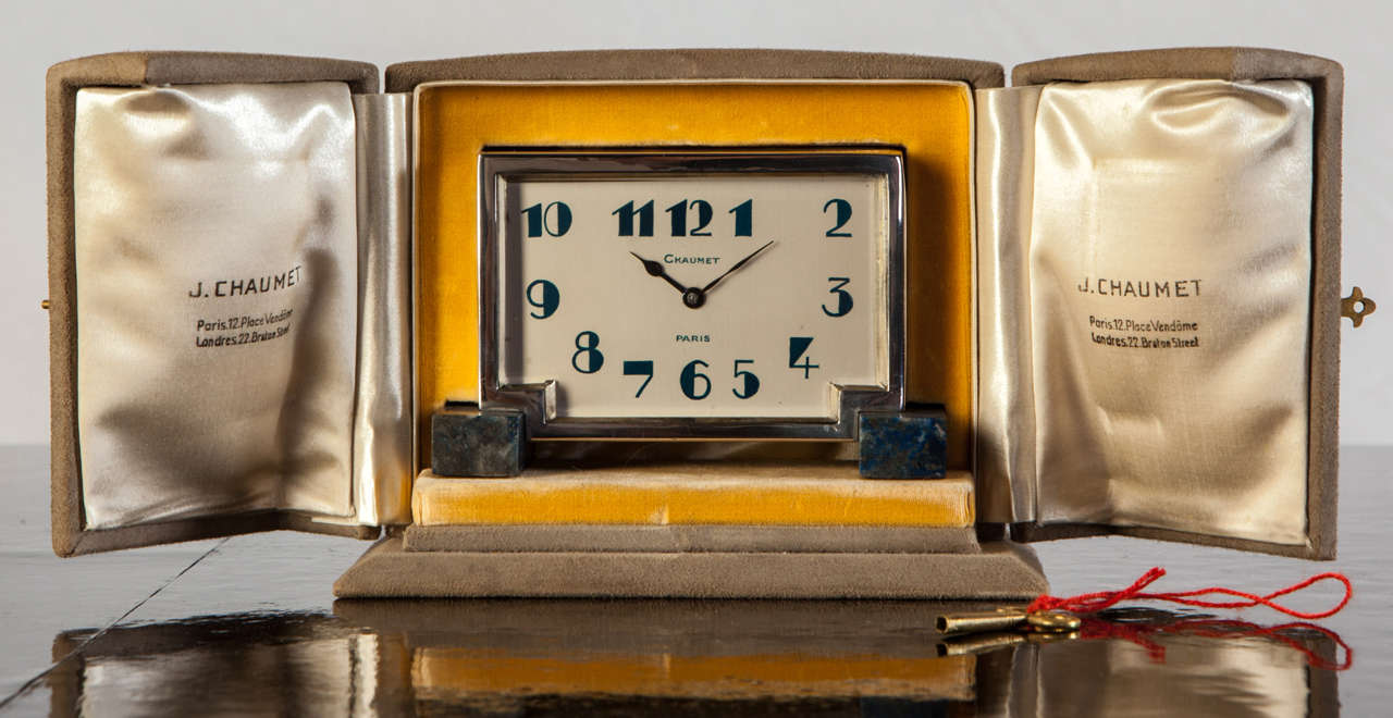 Alarm clock by J. Chaumet, France 1925.
In silver and Lapislazulo with enamelled numbers.
Original box .