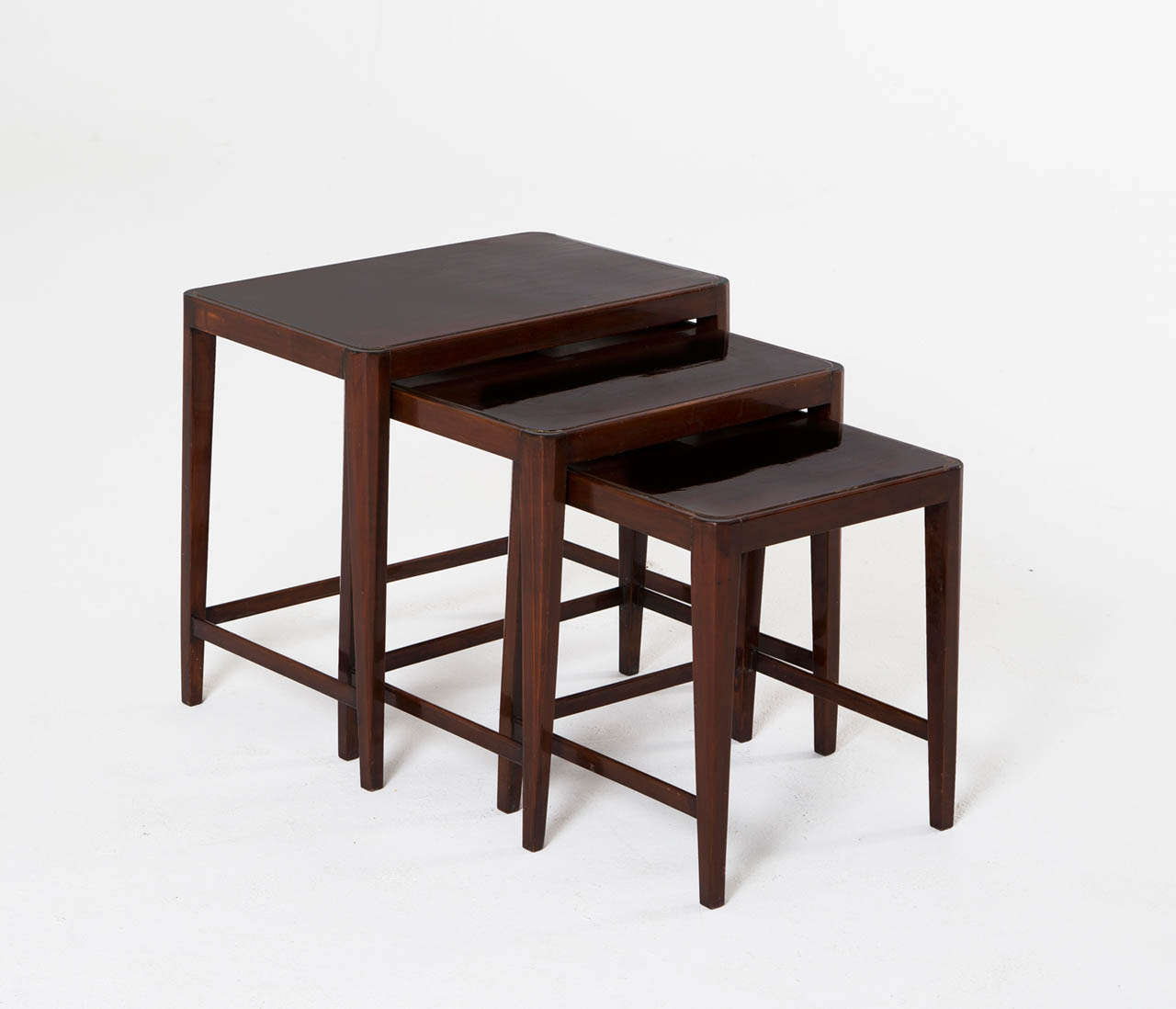 Very sculptural nest of tables in dark stained oak with a high gloss finish.

Free shipping for all European destinations and discounted shipping to all intercontinental destinations starting at $95, depending on the item of your selection.  