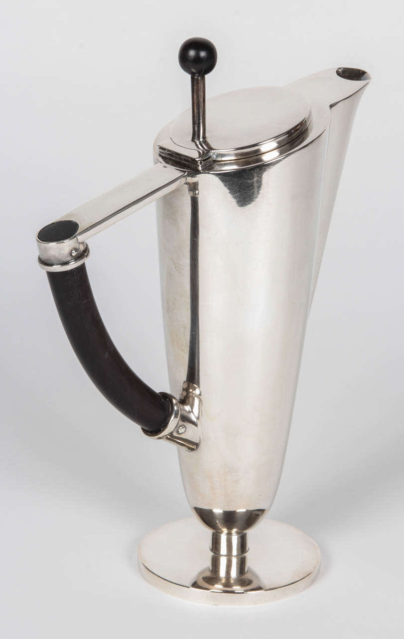 Herman Bauer (founded in 1863) Schwäbisch Gmund, Germany, 

Coffee pot, 1928

Silver with ebony handle and finial.

Marks: HB (in a crown), moon, crown, 288. 

H: 8 1/8