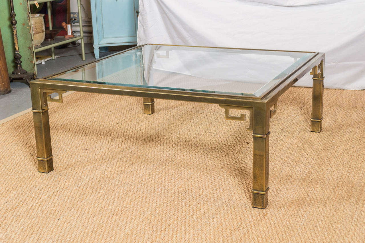 Offering a 1970's coffee table by Mastercraft.  The table is square with a very delicate beveled glass edge.
(We have two in stock right now)