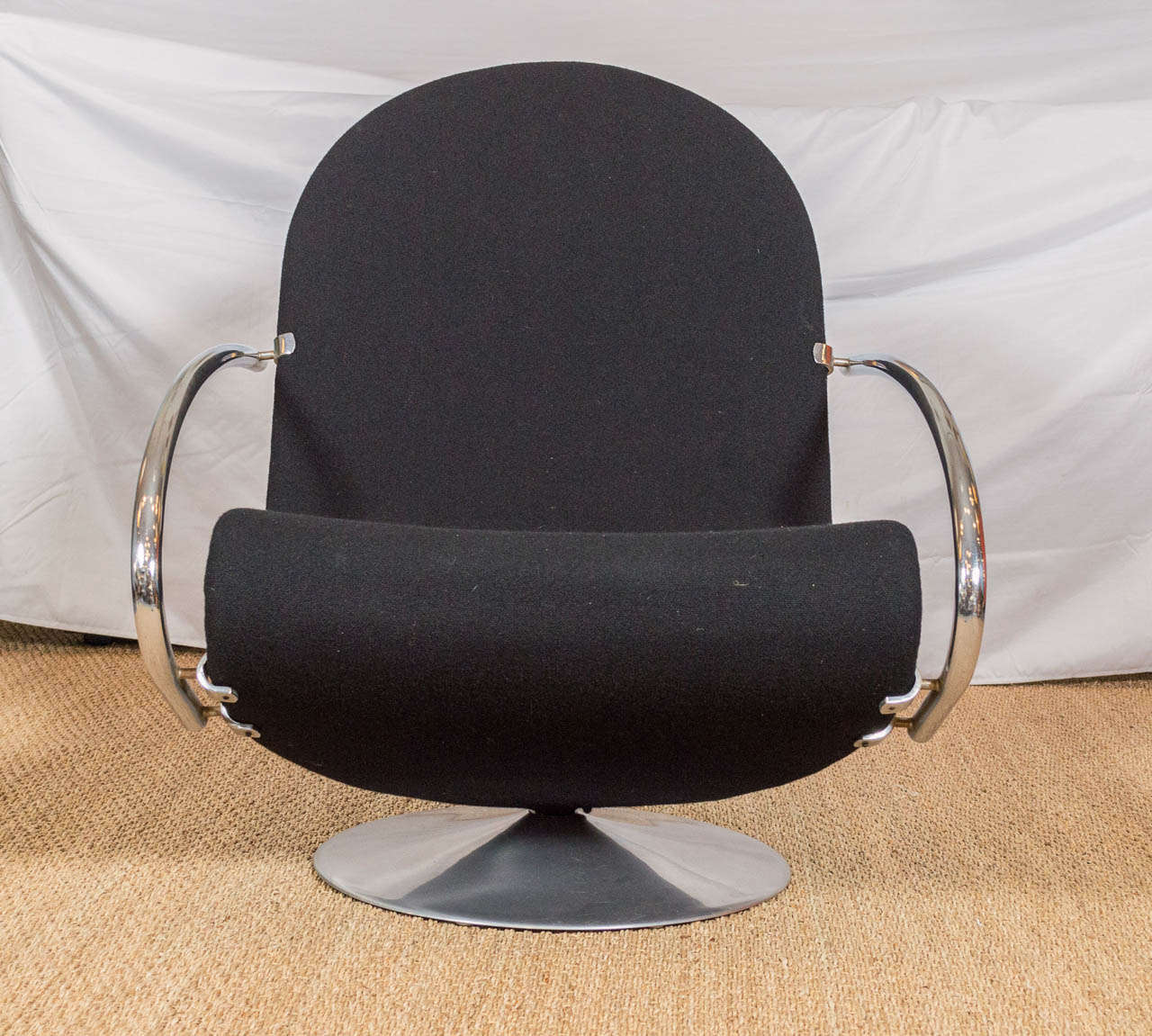 Danish, Fritz Hansen System 123 Model E lounge chair, designed by Verner Panton. Black wool upholstery, chair swivels.