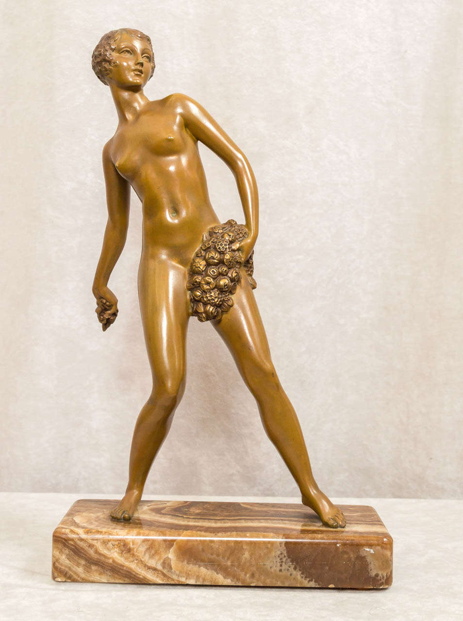 This extremely well executed figure of a nude is candy for the eyes.  The patina is a rich greenish brown and is in remarkable condition.  She has a beautiful face with the finest detailing to include her hair, lips, etc.  It is mounted on a rich