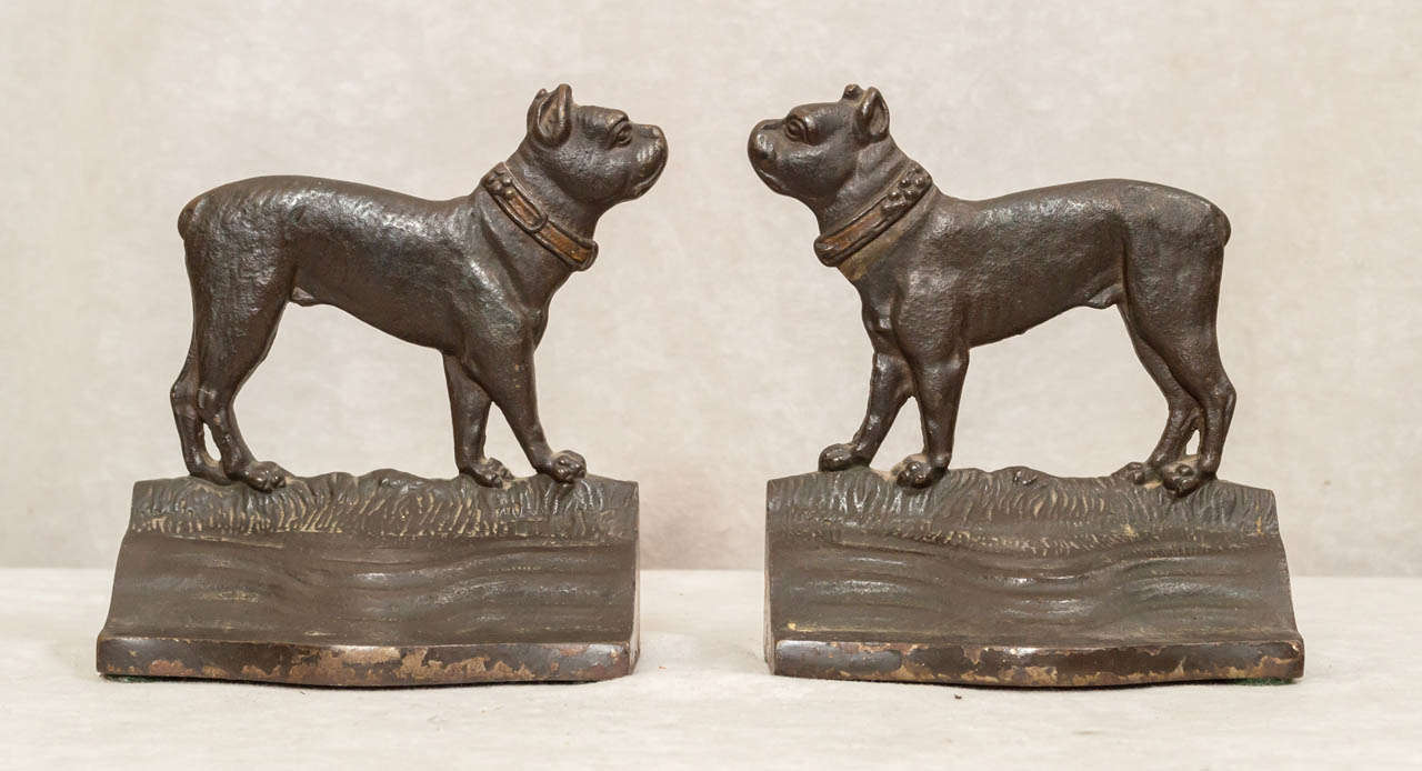 These nicely painted cast iron bookends, although unsigned, we believe they are by the noted American foundry Bradley and Hubbard.  Not too long ago we had a large version of this in a doorstop, which was signed.  These are as finely cast example of