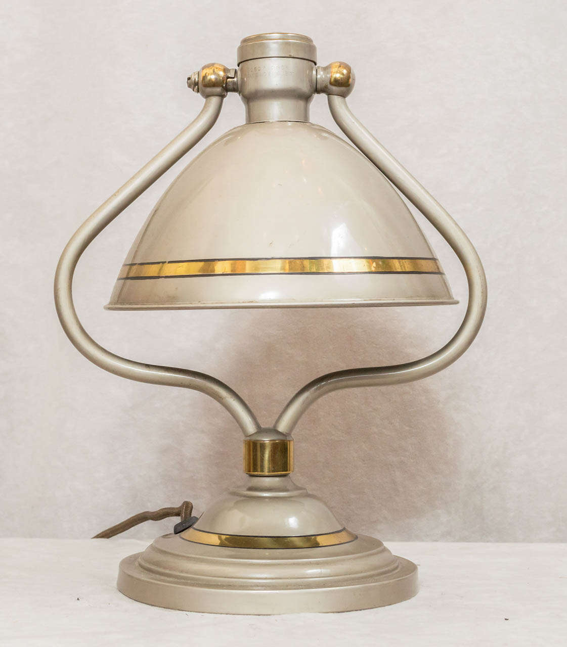 While this lamp is not signed, we recognize the work of Bradley and Hubbard, who were known for nice quality workmanship for well over half a century.  This lamp maintains its original factory paint in what has to be described in remarkable
