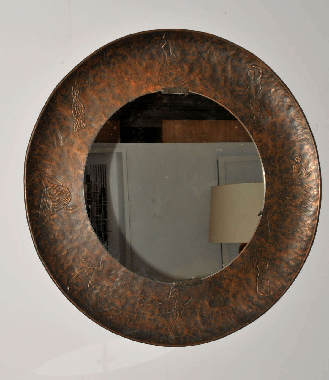 1970's copper mirror by Burchiellaro. One impact on the mirror edge. Normal wear consistent with age and use.