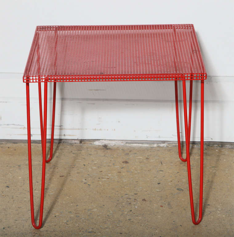 European Modern Mathieu Matégot style Red enamel Perforated Hairpin Accent Table. Featuring a square Red Metal Mesh surface on Red enameled Iron hairpin legs. Versatile. Lightweight. Compact. Sturdy. Portable. Legs removable. Small footprint.