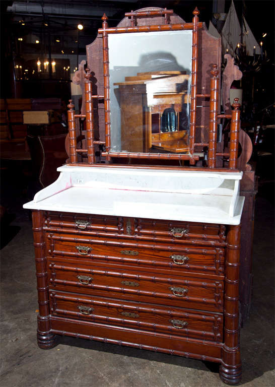 French Faux Bamboo Vanity, c. 1880, with galleried marble top and attached pivoting dressing mirror.