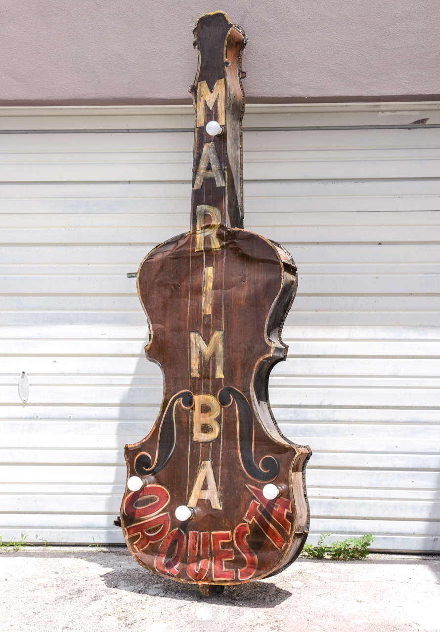 Fantastic painted and lighted tin string bass sign featuring 