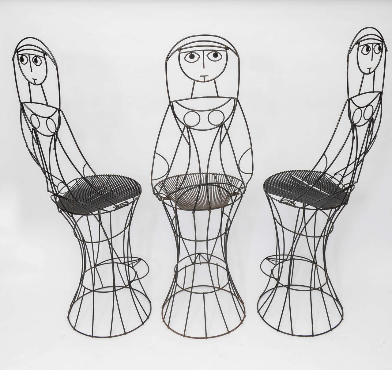  Set of three John Risley Barstools is a whimsical creation seldom seen in the marketplace.
Painted wrought iron.