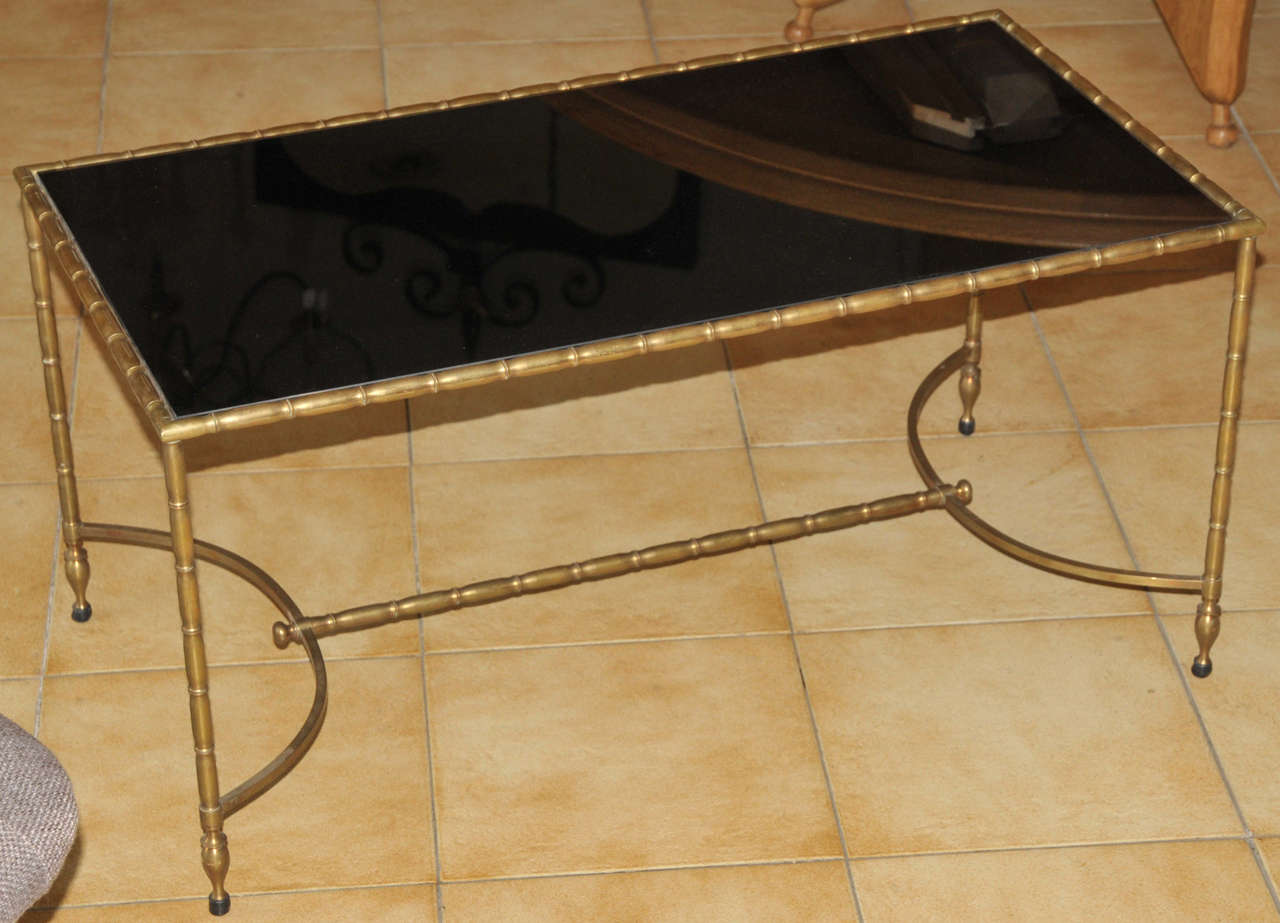 1940s coffee table by Maison Baguès, in gilded bronze with black opaline top.