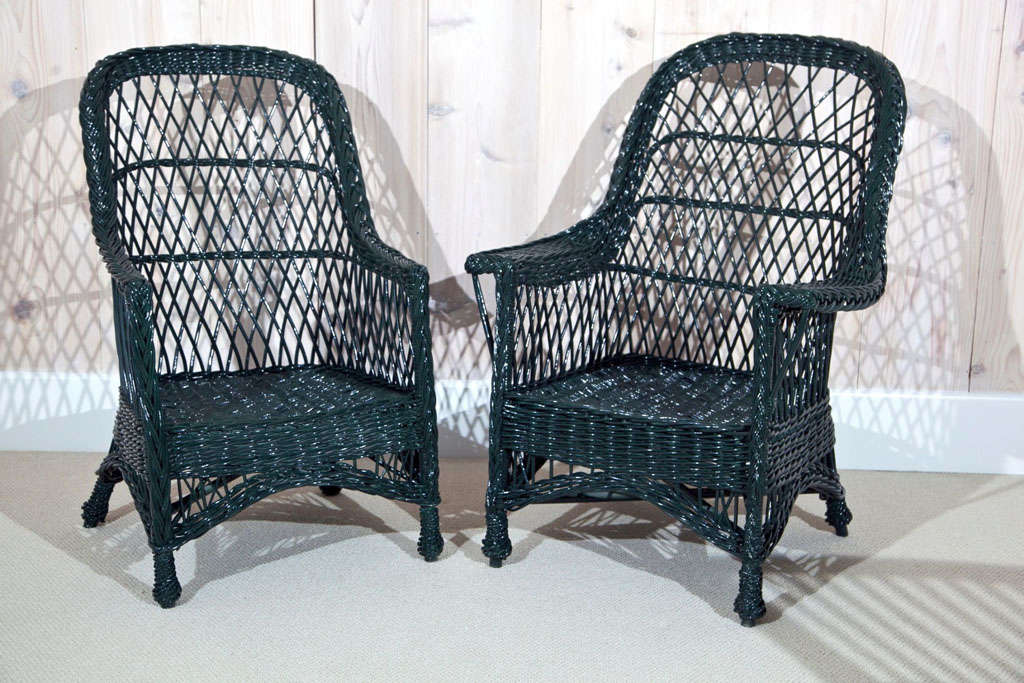 A pair of Wicker Chairs woven of willow in dark green paint.

Chair on Right: Height 41.5, Width 29