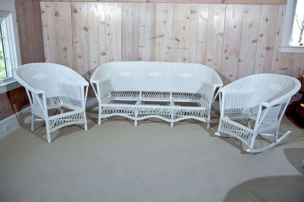 Three piece Wicker Set woven of fiber with drop in spring cushions.